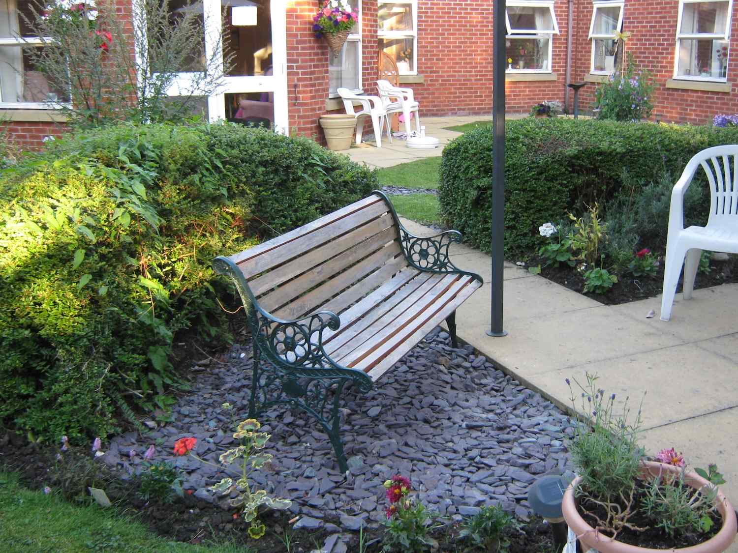 a bench on stones in our garden